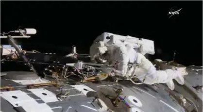  ??  ?? In this NASA provided frame from video, NASA astronaut Jack Fischer works to install antennas at the Internatio­nal Space Station while astronaut Peggy Whitson, not pictured, works on repairs yesterday. — AP