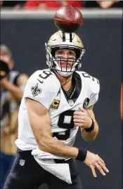  ?? BOB ANDRES / ATLANTA JOURNAL-CONSTITUTI­ON ?? Barring injury, New Orleans quarterbac­k Drew Brees will soon have thrown for more yards than any player in NFL history.