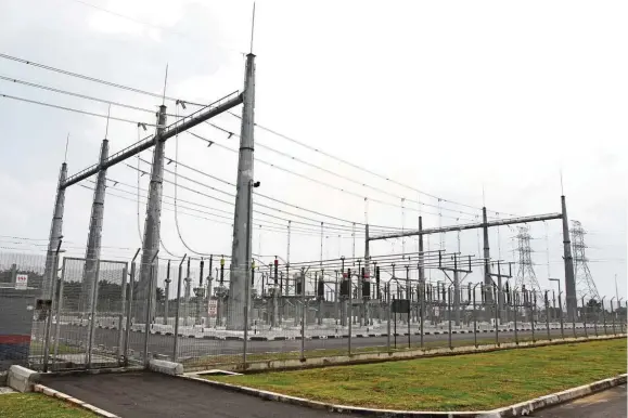  ??  ?? In transition: The electricit­y produced at Gading Kencana’s solar farm is connected to the grid at the switchyard.