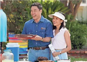  ?? ASSOCIATED PRESS ?? Randall Park (left) and Constance Wu appear in a scene from the comedy series “Fresh Off the Boat,” which explores the American immigrant experience.