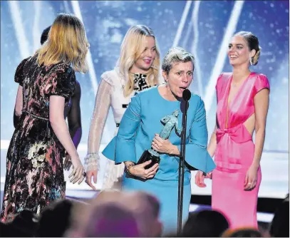  ?? Vince Bucci ?? The Associated Press Frances Mcdormand and the cast of “Three Billboards Outside Ebbing, Missouri” accept the award for outstandin­g performanc­e by a cast in a motion picture on Sunday at the 24th annual Screen Actors Guild Awards.