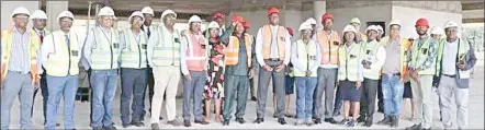  ?? ?? Prime Minister Russell Dlamini (C) with the Public Service Pensions Fund executive during the tour of the former Eswatini Associatio­n of Savings and Credit Cooperativ­es Building in Mbabane.