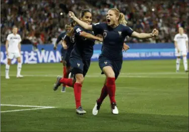  ?? CLAUDE PARIS — THE ASSOCIATED PRESS ?? France’s Eugenie Le Sommer, celebrates with France’s Amel Majri after scoring her side’s second goal on a penalty kick during the Women’s World Cup Group A soccer match between France and Norway in Nice, France Wednesday.