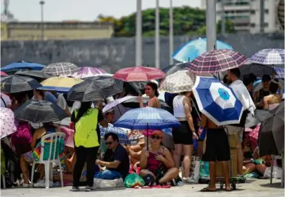  ?? SILVIA IZQUIERDO/ASSOCIATED PRESS/FILE 2023 ?? Taylor Swift fans waited for the doors to open for an Eras Tour concert in Rio in November.