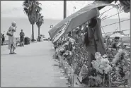  ?? AP/CHRISTIAN MONTERROSA ?? Flowers and other items Tuesday outside the Sea Landing at Santa Barbara Harbor in Santa Barbara, Calif., serve as a memorial for people who likely perished aboard a diving vessel that caught fire early Monday.