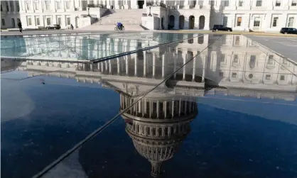  ?? Photograph: Shawn Thew/EPA ?? The US Capitol dome reflected on a puddle in Washington DC.