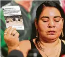  ??  ?? Doris Avardo, Laura’s mother, shows a photo of a young former neighbor left for dead on a dirt road near her home in El Salvador.