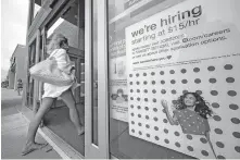  ?? [GENE J. PUSKAR/ASSOCIATED PRESS FILE PHOTO] ?? A sign announcing job openings hangs on the door of a Target store, Sept. 2 in Uniontown, Pa.