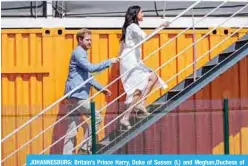  ?? —AFP ?? JOHANNESBU­RG: Britain’s Prince Harry, Duke of Sussex (L) and Meghan,Duchess of Sussex (R) arrive at the Youth Employment Services Hub in Tembisa township.