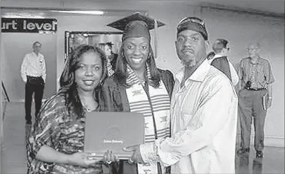  ?? | PROVIDED PHOTO~SUN-TIMES MEDIA ?? Jatika Expose’, shown here with her parents after graduating from Indiana University Bloomingto­n this spring, has been in various schools’ gifted-and-talented or honors program since first grade.
