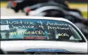  ?? Keith Srakocic ?? The Associated Press One of the vehicles in the funeral procession for Antwon Rose Jr. has a message Monday in Swissvale, Pa.