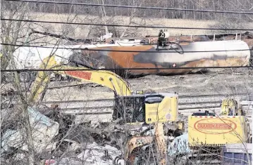  ?? MATT FREED AP ?? Workers continue to remove tank cars Tuesday in East Palestine, Ohio, following the Feb. 3 freight-train derailment.