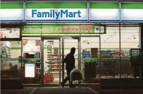  ?? BLOOMPERG PIC ?? FamilyMart UNY Holdings Co is suing to end its Chinese partnershi­p with Ting Hsin Internatio­nal Group.