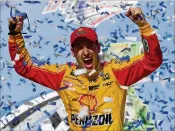  ?? JARED C. TILTON / GETTY IMAGES ?? Joey Logano celebrates in Victory Lane after winning the GEICO 500 at Talladega Superspeed­way on Sunday in Talladega, Alabama.