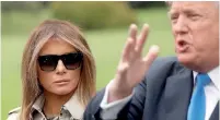  ??  ?? First Lady Melania Trump looks on as US President Donald Trump speaks to reporters. Reuters