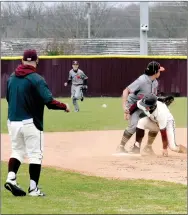  ?? MARK HUMPHREY ENTERPRISE-LEADER ?? Former Lincoln baseball coach J. Keith watches as sophomore Kellar Price successful­ly steals third base during a Thursday, March 24, 2022, win over Newport by a 9-3 score at a spring break tournament organized by Keith. He resigned last week to take the head coaching job at Siloam Springs.