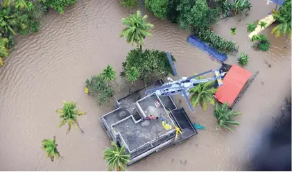  ??  ?? Navy chopper engaged in rescue operations in flood-hit Kerala