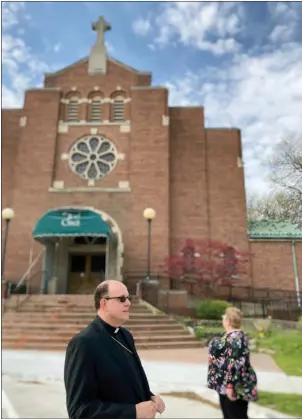  ?? PHOTOS BY GINA JOSEPH — THE MACOMB DAILY ?? ABOVE: Pictured are the Rev. Jeffrey Harris and Sister Karen Amato of Troy. Harris will be a bishop and she Amato a deacon of the North American Old Catholic Church. BELOW: The Rev. Jeffrey Harris stands outside Sacred Heart Catholic Church in Roseville. He’s looking for a location for his new church, Saint Sara Old Catholic Church, in Mount Clemens.