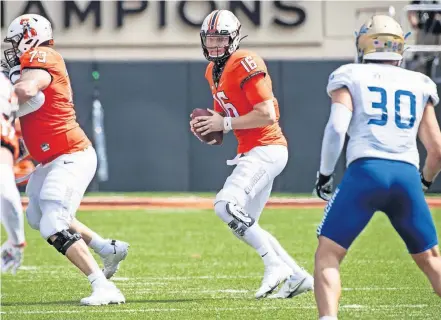  ??  ?? Oklahoma State quarterbac­k Shane Illingwort­h (16) looks downfield during a play Saturday in a 16-7 win against Tulsa at Boone Pickens Stadium in Stillwater. [ROB FERGUSON/USA TODAY SPORTS]
