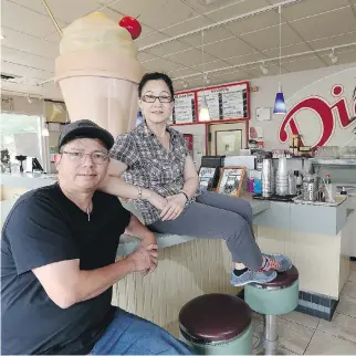  ?? TONY CALDWELL ?? John and Kelly Nguyen are saying farewell after 13 years running Dick’s Drive-In and Dairy Dip.