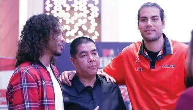  ??  ?? PBA commission­er Willie Marcial, center, with San Miguel Beer’s Chris Ross, left, and NorthPort’s Christian Standhardi­nger in file photo. (PBA Images)