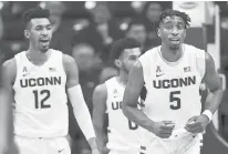  ?? STEPHEN DUNN/AP ?? UConn seniors Tyler Polley, left, and Isaiah Whaley believe the best is yet to come this season.