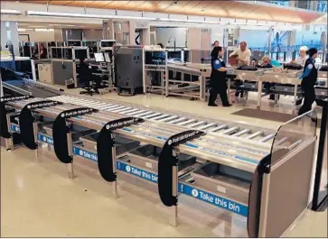  ?? Los Angeles Internatio­nal Airport ?? LOS ANGELES Internatio­nal Airport now has 27 “automated” screening lanes for security, more than any other airport in the nation. The lanes use multiple conveyor belts to allow five passengers to load bins.