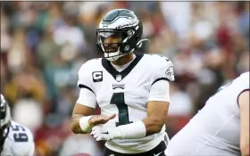  ?? DANIEL KUCIN JR. - THE ASSOCIATED PRESS ?? FILE - Philadelph­ia Eagles quarterbac­k Jalen Hurts (1) gestures during an NFL football game against the Washington Football Team, Sunday, Jan. 2, 2022, in Landover, Md. The Eagles play the Tampa Bay Buccaneers in an NFC wild-card game on Sunday.