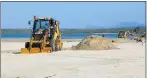  ??  ?? OPENING UP: Excavators work in tandem to dig trenches at the causeway, after the municipali­ty obtained permission for breaches to be done at the estuary