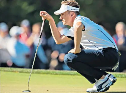  ??  ?? Club man: Ian Poulter has gone back to this Odyssey 7 putter that sparked the ‘Miracle at Medinah’ in the 2012 Ryder Cup