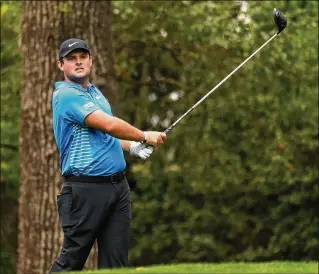  ?? GETTY IMAGES ?? Patrick Reed plays his tee shot on the second druing Saturday’s third round. Reed led the Augusta State Jaguars to national championsh­ips in 2010 and 2011. He also played one season at Georgia.