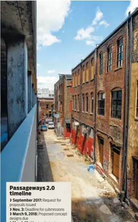  ?? STAFF PHOTO BY DOUG STRICKLAND ?? The alley behind the new Market City Center apartment building at 728 Market St. will undergo a renovation to create a permanent art and architectu­re installati­on.