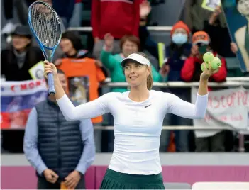  ??  ?? Russia’s Maria Sharapova celebrates after beating Peng Shuai of China 6-3, 6-1 in their WTA Tianjin Open semifinal in China on Saturday. —