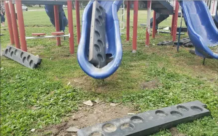  ?? KEITH REYNOLDS — THE MORNING JOURNAL ?? Damaged slides, garbage and broken border pieces mar Sunnyside Park on Reeves Avenue south of West 24th Street in Lorain. Police began searching for the culprits Aug. 15.