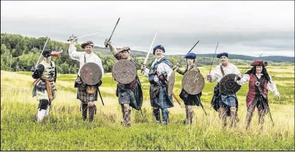  ?? SUBMITTED PHOTO ?? A few members of Gallus Gael prepare for battle. The re-enactment group brings the 18th century Scottish highlands to life.