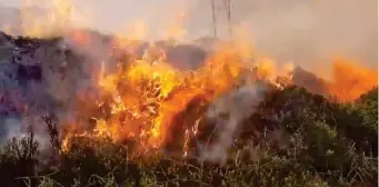  ??  ?? Blaze: Fourteen fire engines were needed to fight flames at Ilkley Moor