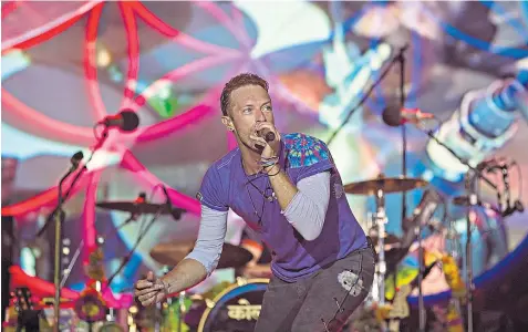  ??  ?? Chris Martin: ‘Glastonbur­y makes us believe we can do anything’