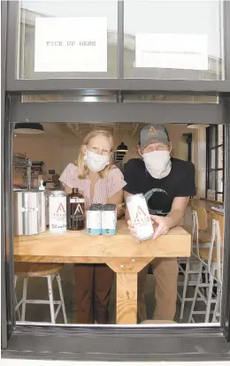  ?? PAUL W. GILLESPIE/CAPITAL GAZETTE ?? Owners Claire and Cam Bowdren at the to go window at Forward Brewing.