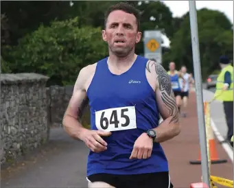  ?? Photo by Michelle Cooper Galvin ?? Tony Harty Fossa winning the Gneeveguil­la AC 1 Mile Road Race in Fossa, Killarney on Wednesday