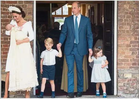  ??  ?? Family affair: Catherine carrying Louis as William escorts George and Charlotte after Louis’ christenin­g service at the Chapel Royal, St James’ Palace, London. — AFP