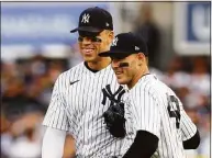  ?? Elsa / Getty Images ?? The Yankees’ Aaron Judge, left, and Anthony Rizzo react after the first out was recorded against the Houston Astros during the second inning in Game 3 of the American League Championsh­ip Series at Yankee Stadium on Oct. 22.