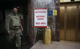  ?? Getty imageS ?? TAKE A LOAD OFF: A sign in the Dirksen Senate Office Building shows that National Guard personnel are authorized to rest in the area.