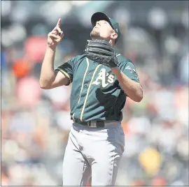  ?? NHAT V. MEYER — STAFF PHOTOGRAPH­ER ?? Closer Blake Treinen celebrates the A’s 6-2 win over the Giants in his final appearance before heading to Washington D.C. for Tuesday’s All-Star Game.