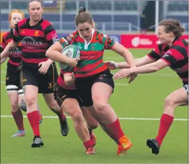  ?? Photograph: Stephen Lawson. ?? Determinat­ion on the face of Kirsty Sinclair on her way to scoring a try.