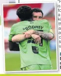  ??  ?? BIG HUG: Dave Worrall congratula­tes Devante Rodney.