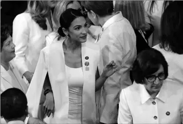  ?? ASSOCIATED PRESS ?? DEMOCRATIC MEMBERS OF CONGRESS, including Rep. Alexandria Ocasio-Cortez, D-N.Y., (center) arrive before President Donald Trump delivers his State of the Union address to a joint session of Congress on Capitol Hill in Washington Tuesday.