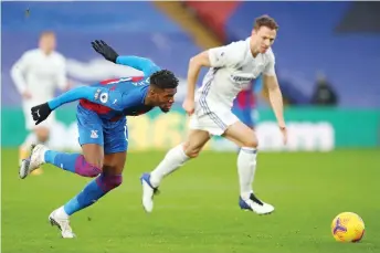  ?? — AFP photo ?? Crystal Palace’s Wilfried Zaha chases after the ball in front of Leicester City’s Jonny Evans during the English Premier League match at Selhurst Park in south London.