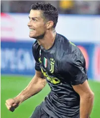  ?? AP ?? Cristiano ronaldo erased the frustratio­n of his Champions League red card midweek by scoring the opener. —