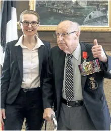  ?? STRINGER/THE CANADIAN PRESS ?? Royal Canadian Navy veteran, Fred Turnbull, 92, gives the thumbs up next to Laurence Monmayrant, Consul General of France for the Atlantic Provinces, after he received the French Legion of Honour during a ceremony at CFB Halifax in Halifax, Friday....