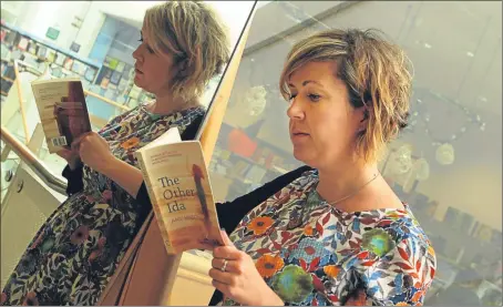  ?? Picture: John Stevenson. ?? Amy Mason with her book ‘The Other Ida’ which has won the Dundee Internatio­nal Book Prize.